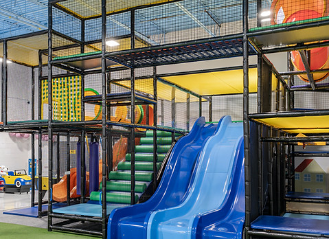 Indoor play structure with slides at kids playground in Mississauga