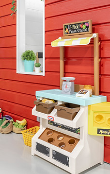 Pretend play mini town area inside indoor playground in Mississauga